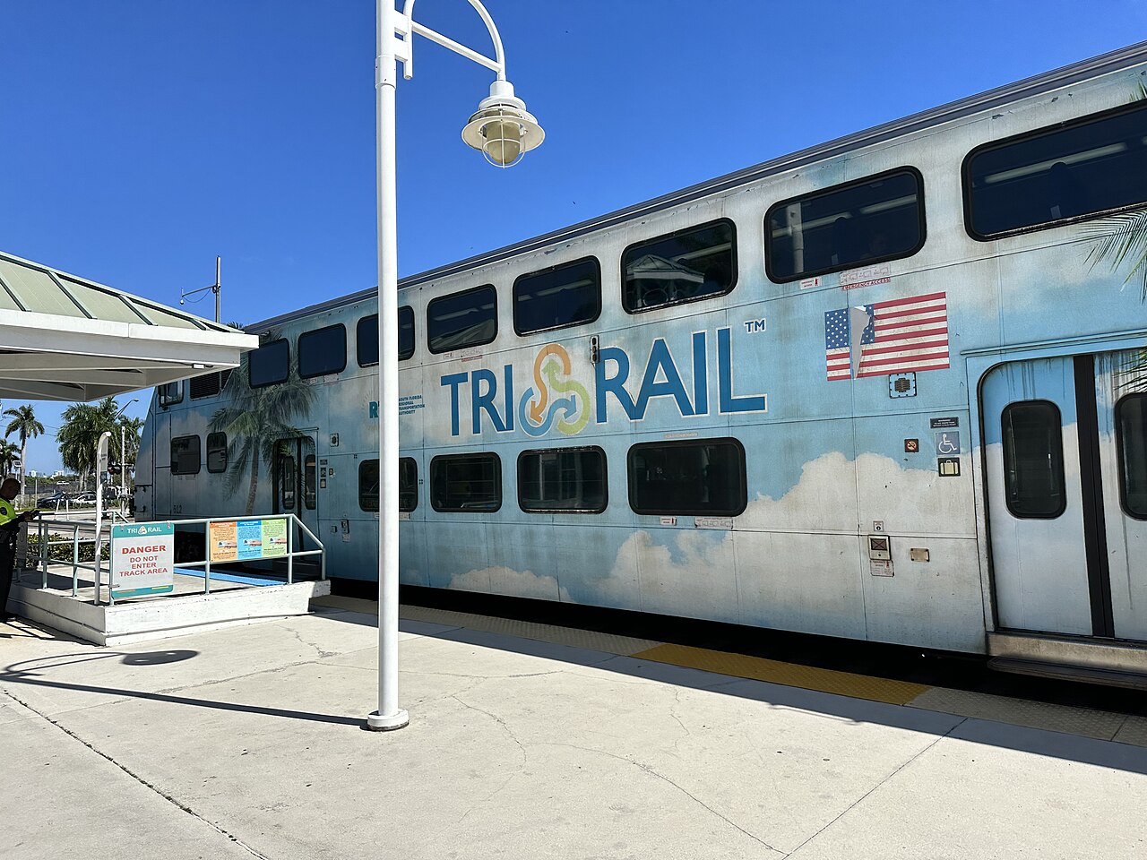 Tri-Rail passenger train beside the platform at Fort Lauderdale Airport station.
